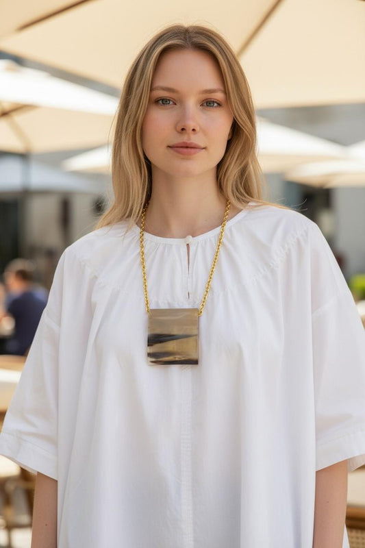 Collier doré pendentif rectangle effet corne x AFRICA