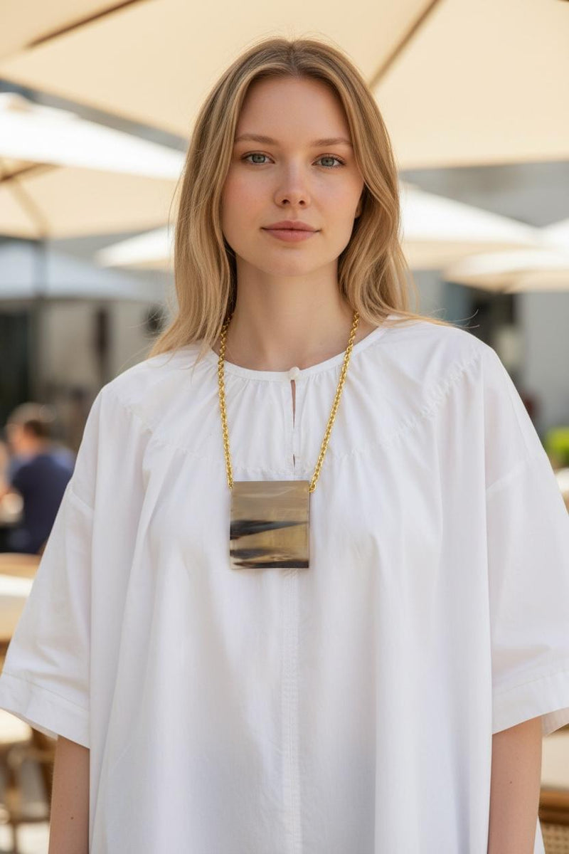 Collier doré pendentif rectangle effet corne x AFRICA